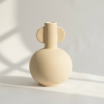https://cdn.shopify.com/s/files/1/2596/6404/files/ceramic-vase-with-natural-window-lighting.png?v=1761333294
